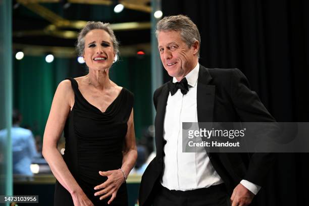 In this handout photo provided by A.M.P.A.S., Andie MacDowell and Hugh Grant are seen backstage during the 95th Annual Academy Awards on March 12,...