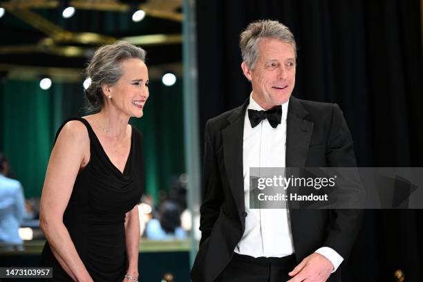 In this handout photo provided by A.M.P.A.S., Andie MacDowell and Hugh Grant are seen backstage during the 95th Annual Academy Awards on March 12,...