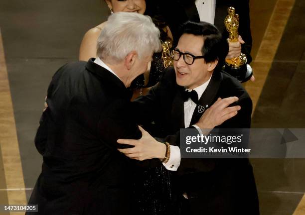 Ke Huy Quan accepts the award for Best Picture for "Everything Everywhere All at Once" from Harrison Ford onstage during the 95th Annual Academy...