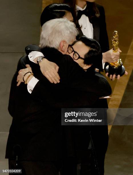 Ke Huy Quan accepts the award for Best Picture for "Everything Everywhere All at Once" from Harrison Ford onstage during the 95th Annual Academy...