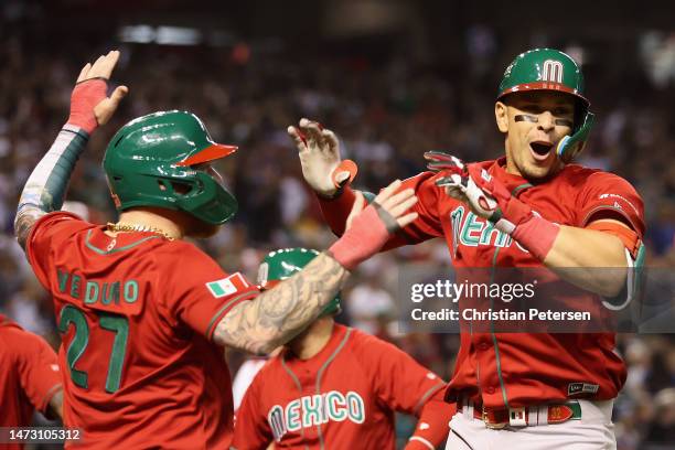 Joey Meneses of Team Mexico celebrates with Alex Verdugo fter hitting a three-run home run against Team USA during the fourth inning of the World...