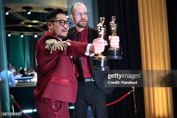 In this handout photo provided by A.M.P.A.S., Best Original Screenplay winners for "Everything Everywhere All at Once," Daniel Kwan and Daniel...