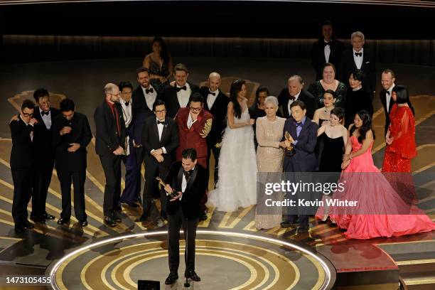 Jonathan Wang accepts the Best Picture award for "Everything Everywhere All at Once" along with cast and crew onstage during the 95th Annual Academy...