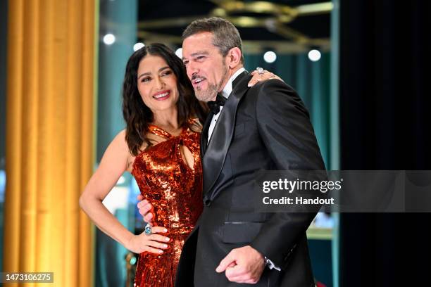 In this handout photo provided by A.M.P.A.S., Salma Hayek and Antonio Banderas are seen backstage during the 95th Annual Academy Awards on March 12,...