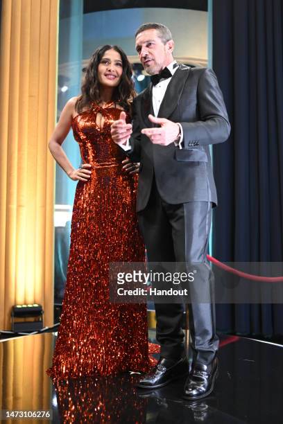In this handout photo provided by A.M.P.A.S., Salma Hayek and Antonio Banderas are seen backstage during the 95th Annual Academy Awards on March 12,...