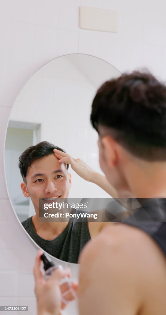 Man use hair growing tonic