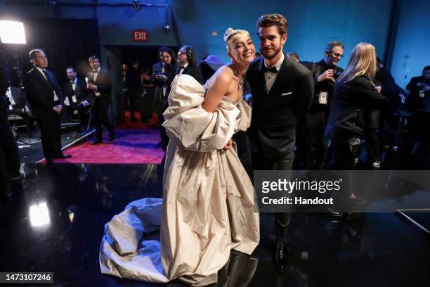 In this handout photo provided by A.M.P.A.S., Florence Pugh and Andrew Garfield are seen backstage during the 95th Annual Academy Awards on March 12,...