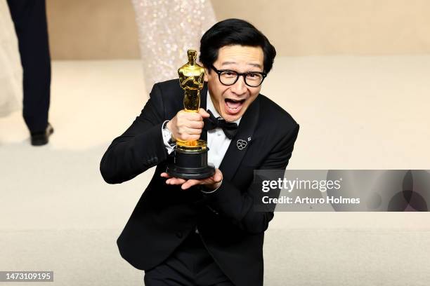 Ke Huy Quan, winner of the Best Supporting Actor award for "Everything Everywhere All at Once," poses in the press room during the 95th Annual...