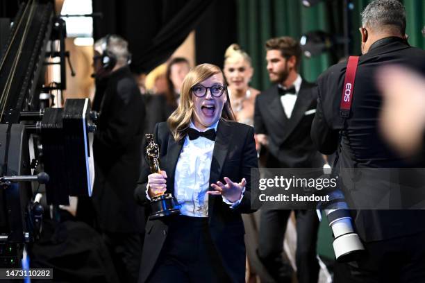 In this handout photo provided by A.M.P.A.S., Best Adapted Screenplay winner for "Women Talking," Sarah Polley is seen backstage during the 95th...