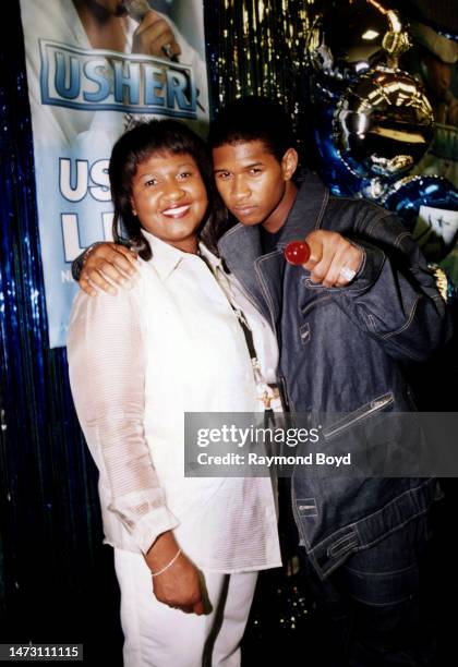 Singer Usher poses for photos with his mother Jonetta Patton during his first annual 'Usher Fan Appreciation Weekend' in Atlanta, Georgia in April...