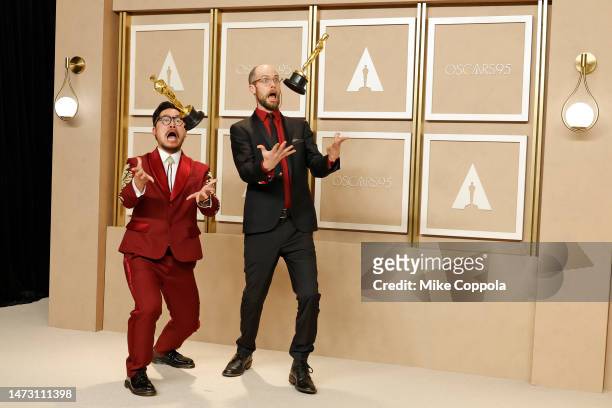 Dan Kwan and Daniel Scheinert, winners of the Best Director and Best Picture award for "Everything Everywhere All at Once," pose in the press room...