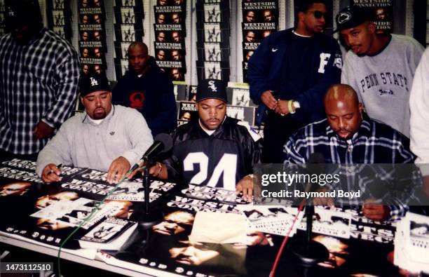 Rappers Mack 10 , Ice Cube and WC of Westside Connection signs autographs and greets fans at George's Music Room in Chicago, Illinois in October 1996.