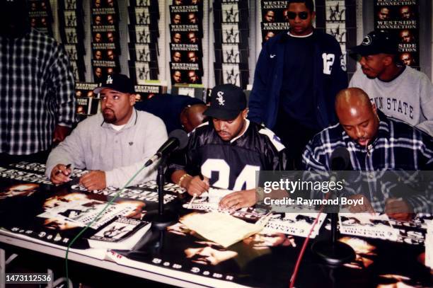 Rappers Mack 10 , Ice Cube and WC of Westside Connection signs autographs and greets fans at George's Music Room in Chicago, Illinois in October 1996.
