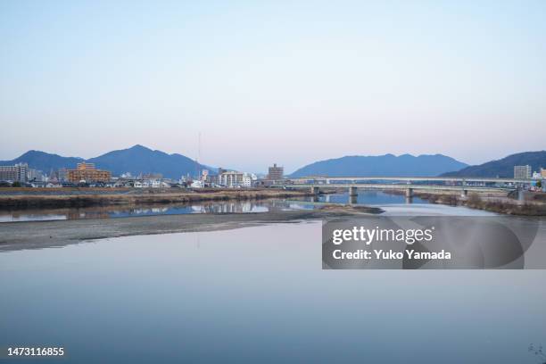 riverside view in twilight - hiroshima stock pictures, royalty-free photos & images