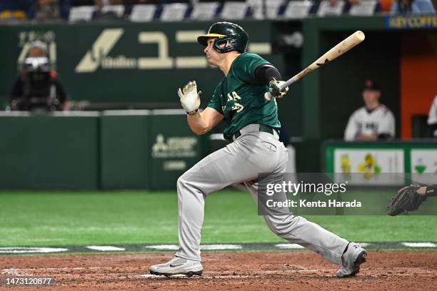 Tim Kennelly of Australia hits a single in the eighth inning during the World Baseball Classic Pool B game between Australia and Czech Republic at...