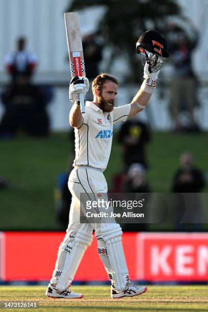 Kane Williamson of New Zealand raises his bat after scoring a century during day five of the First Test match in the series between New Zealand and...