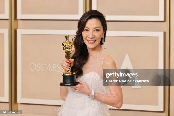Michelle Yeoh, winner of the Best Actress in a Leading Role award for ‘Everything Everywhere All at Once’, poses in the press room during the 95th...