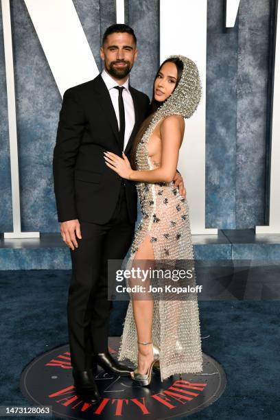 Sebastian Lletget and Becky G attend the 2023 Vanity Fair Oscar Party Hosted By Radhika Jones at Wallis Annenberg Center for the Performing Arts on...