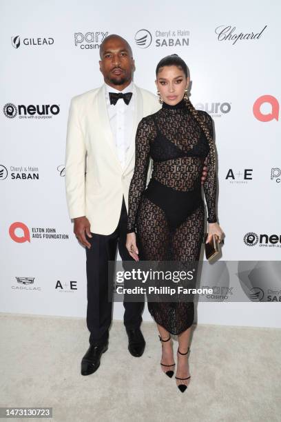 Larry English and Nicole Williams English attend Elton John AIDS Foundation's 31st annual academy awards viewing party on March 12, 2023 in West...