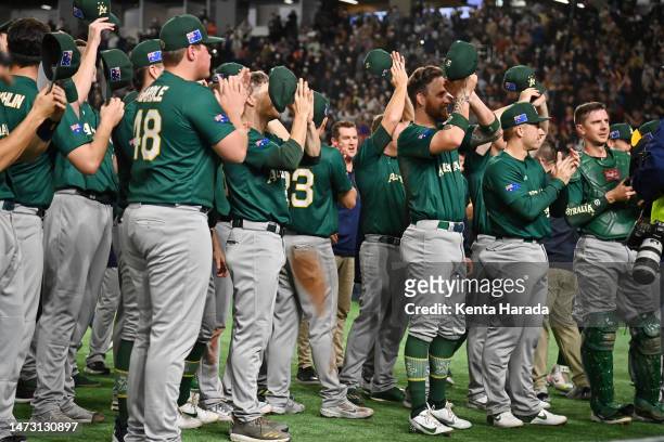 Australia players applaud fans after the team's victory confirming the qualification for the quarterfinal following the World Baseball Classic Pool B...