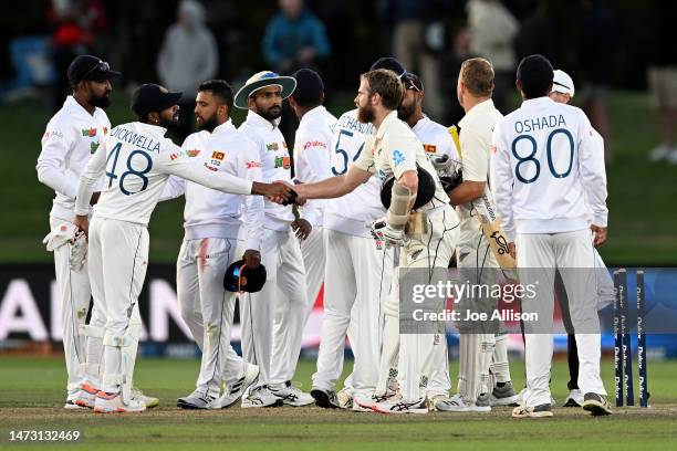 Kane Williamson of New Zealand shakes hands with Niroshan Dickwella of Sri Lanka during day five of the First Test match in the series between New...