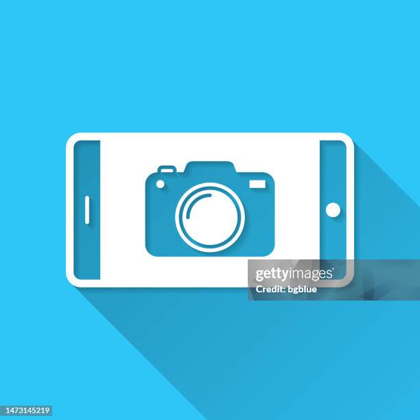 smartphone with camera. icon on blue background - flat design with long shadow - digital camera stock illustrations