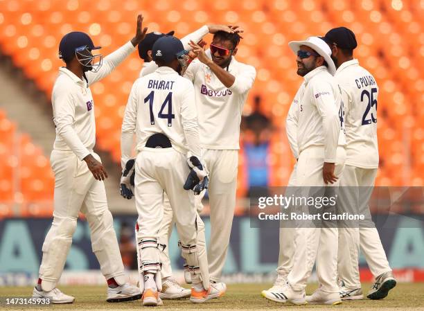 Axar Patel of India celebrates taking the wicket of Travis Head of Australia during day five of the Fourth Test match in the series between India and...