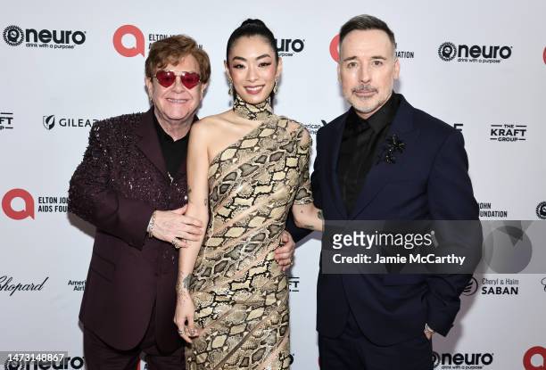 Elton John, Rina Sawayama and David Furnish attend the Elton John AIDS Foundation's 31st Annual Academy Awards Viewing Party on March 12, 2023 in...