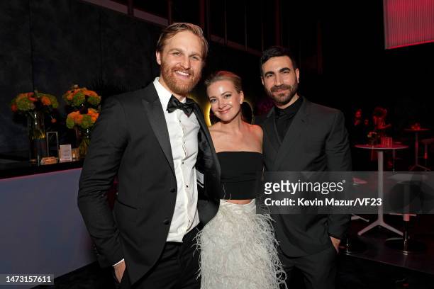 Wyatt Russell, Meredith Hagner, and Brett Goldstein attend the 2023 Vanity Fair Oscar Party Hosted By Radhika Jones at Wallis Annenberg Center for...