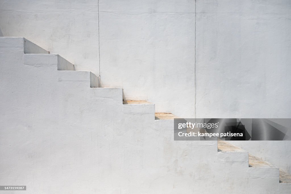 Steps Against White Wall In Modern Building
