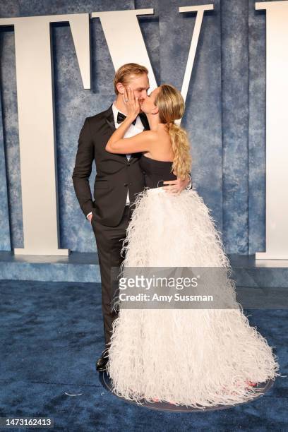 Wyatt Russell and Meredith Hagner attend the 2023 Vanity Fair Oscar Party Hosted By Radhika Jones at Wallis Annenberg Center for the Performing Arts...