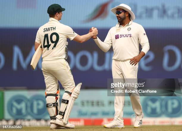 Steve Smith of Australia and Rohit Sharma of India are seen as the match ends in a draw during day five of the Fourth Test match in the series...