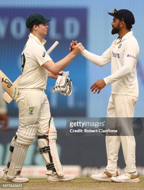 Steve Smith of Australia and Virat Kohli of India are seen as the match ends in a draw during day five of the Fourth Test match in the series between...