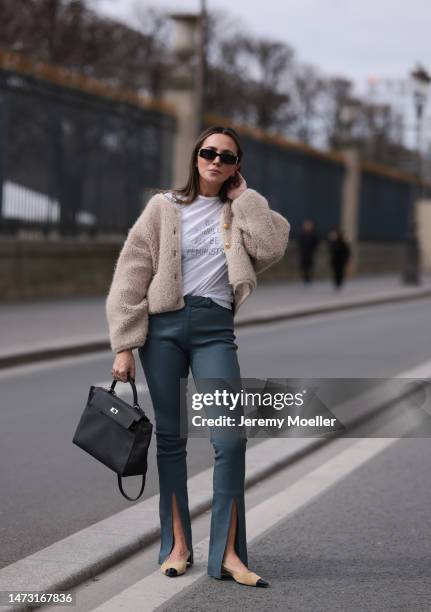 Yasemin Ögün seen wearing Balenciaga black shades, black big Hermes Kelly bag, green pants Museforall, beige / black Chanel shoes, white Dior top...