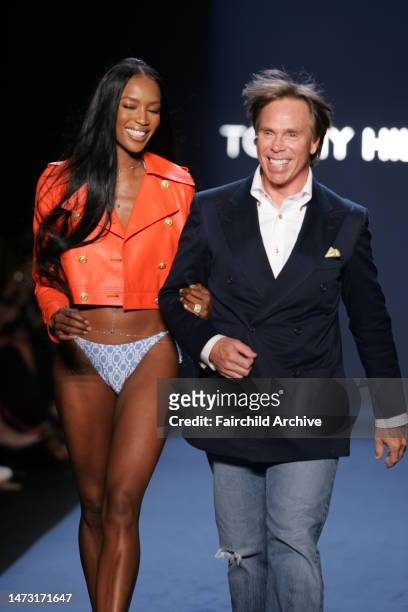 Designer Tommy Hilfiger and Naomi Campbell walk down the runway at the Spring 2005 Tommy Hilfiger show in New York.