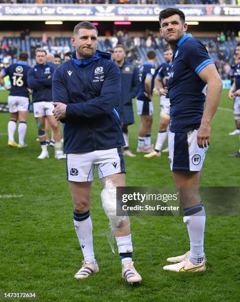 Scotland player Finn Russell and Blair Kinghorn react after the Six Nations Rugby match between Scotland and Ireland at Murrayfield Stadium on March...