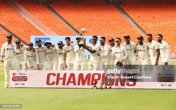 India celebrate after they retained the Border Gavaskar Trophy on day five of the Fourth Test match in the series between India and Australia at...