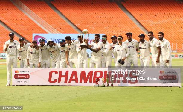 India celebrate after they retained the Border Gavaskar Trophy on day five of the Fourth Test match in the series between India and Australia at...