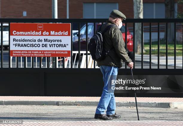 An elderly man walks in front of the Francisco de Vitoria residence on March 13 in Alcala de Henares, Madrid, Spain. The health inspection of the...