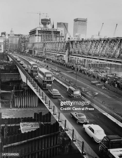 Section of the new London Bridge was opened to traffic and pedestrians this morning, constructed by John Mowlem & Co Ltd and costing £4 million it is...