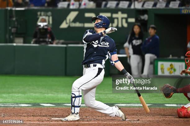 Kunwoo Park of Team Korea hits a walk-off grand-slam home run to make it 2-18 in the forth inning during the World Baseball Classic Pool B game...