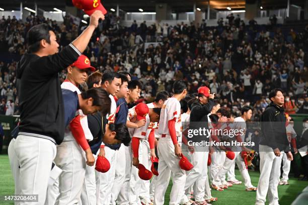China players applaud fans after the World Baseball Classic Pool B game between Korea and China at Tokyo Dome on March 13, 2023 in Tokyo, Japan.
