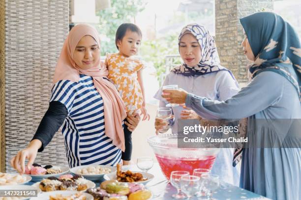 siblings hang out  before iftar - muslims prepare for eid in indonesia stock pictures, royalty-free photos & images