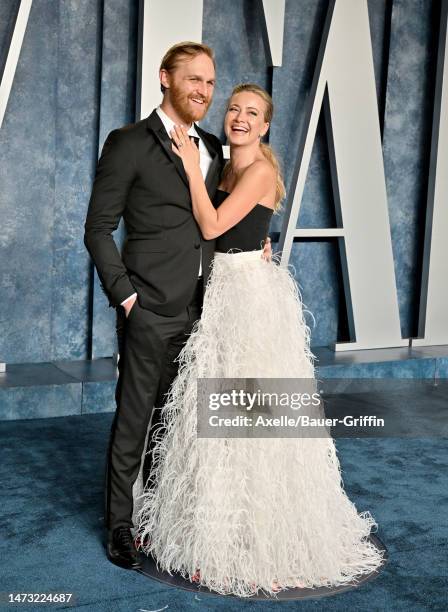 Wyatt Russell and Meredith Hagner attend the 2023 Vanity Fair Oscar Party hosted by Radhika Jones at Wallis Annenberg Center for the Performing Arts...