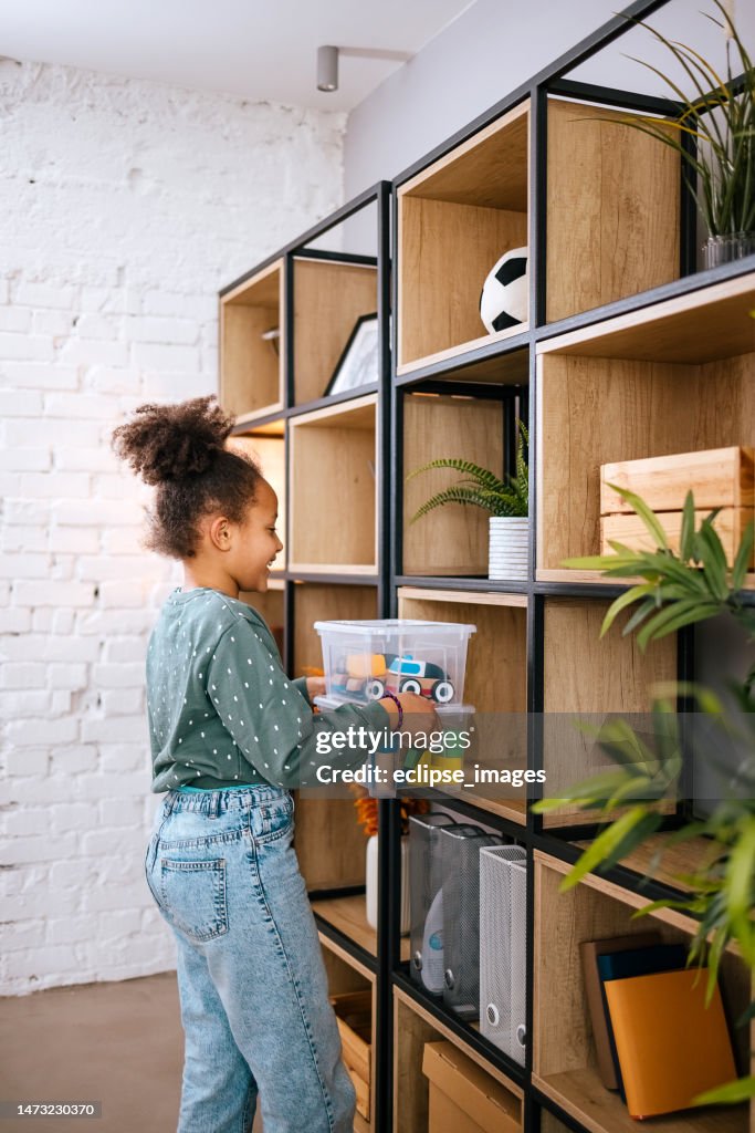 Girl helps her mother clean the house