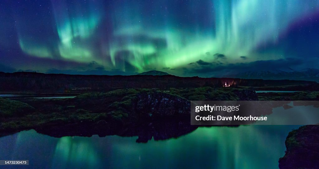 Aurora displaying over the Silfra Rift in Iceland