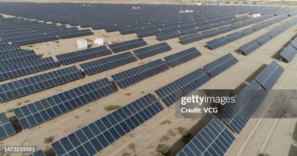 Aerial view of a photovoltaic power station at the Gobi Desert on March 12, 2023 in Hami, Xinjiang Uygur Autonomous Region of China.