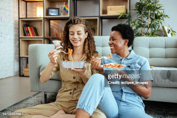 enjoying at home - order takeout stock pictures, royalty-free photos & images