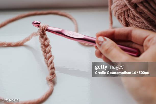 cropped hands of woman knitting wool at home,indonesia - crochet stock pictures, royalty-free photos & images