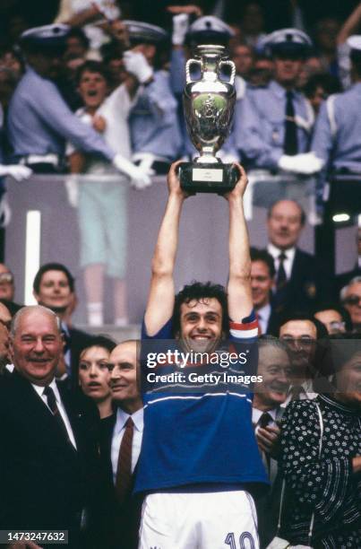France captain Michel Platini holds aloft the European Championships trophy after their 2-0 final victory against Spain at Parc des Princes on June...